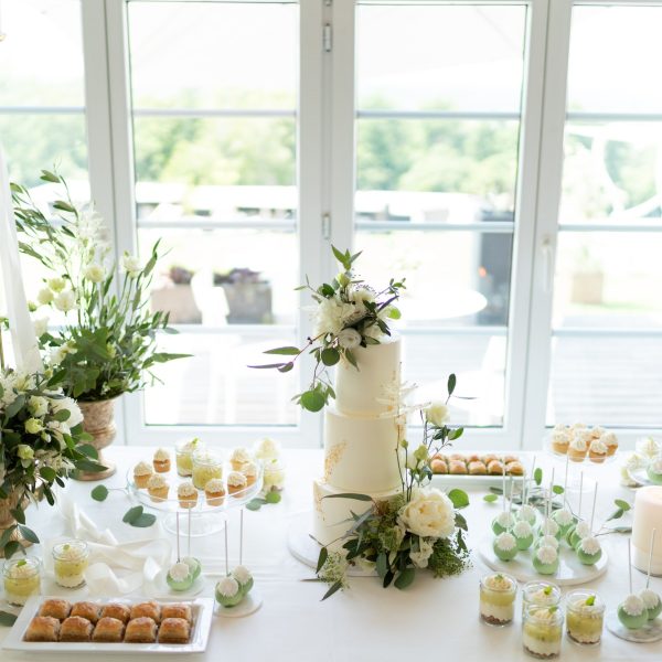 wedding-cake-cupcakes-and-sweets-on-a-nicely-decorated-event-table.jpg
